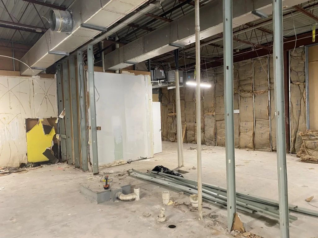 Interior view of a room filled with construction tools and machinery