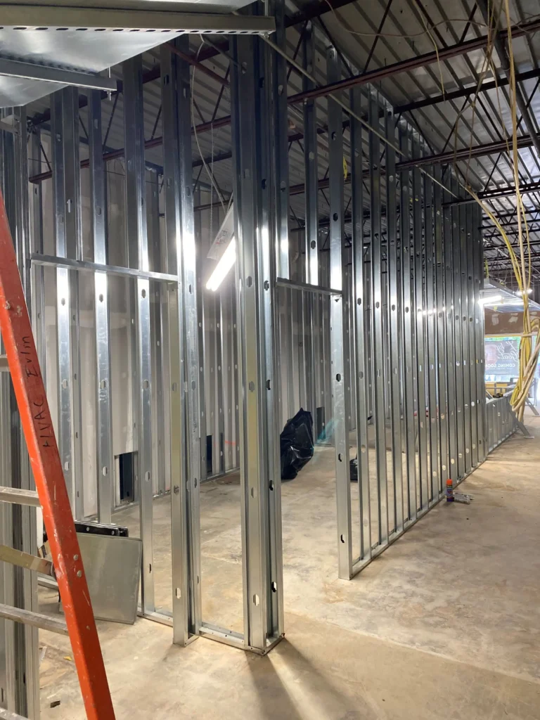 A spacious room featuring metal framing