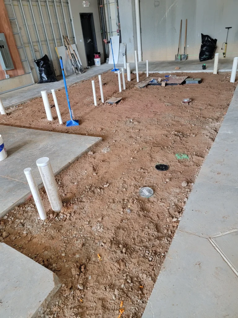 An interior space with a dirt floor