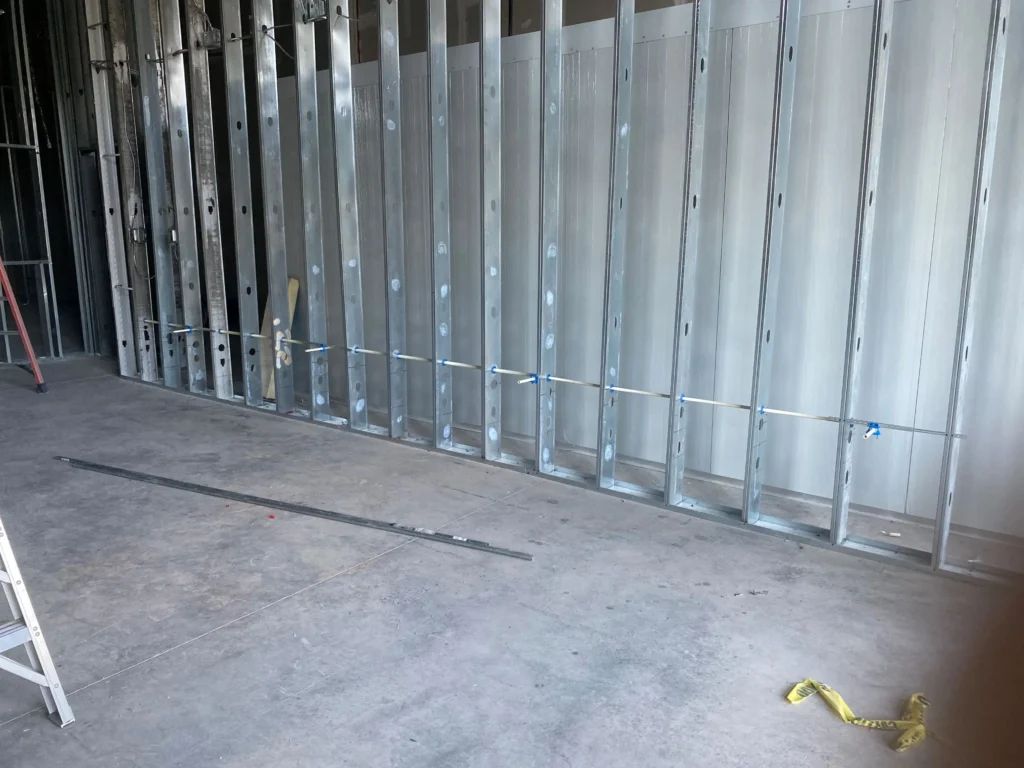 An interior space with metal framing and a ceiling