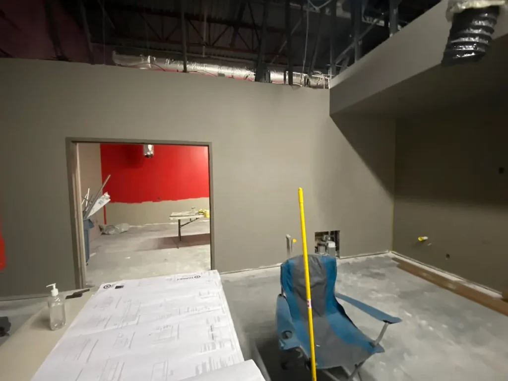 A room containing a chair and a ladder