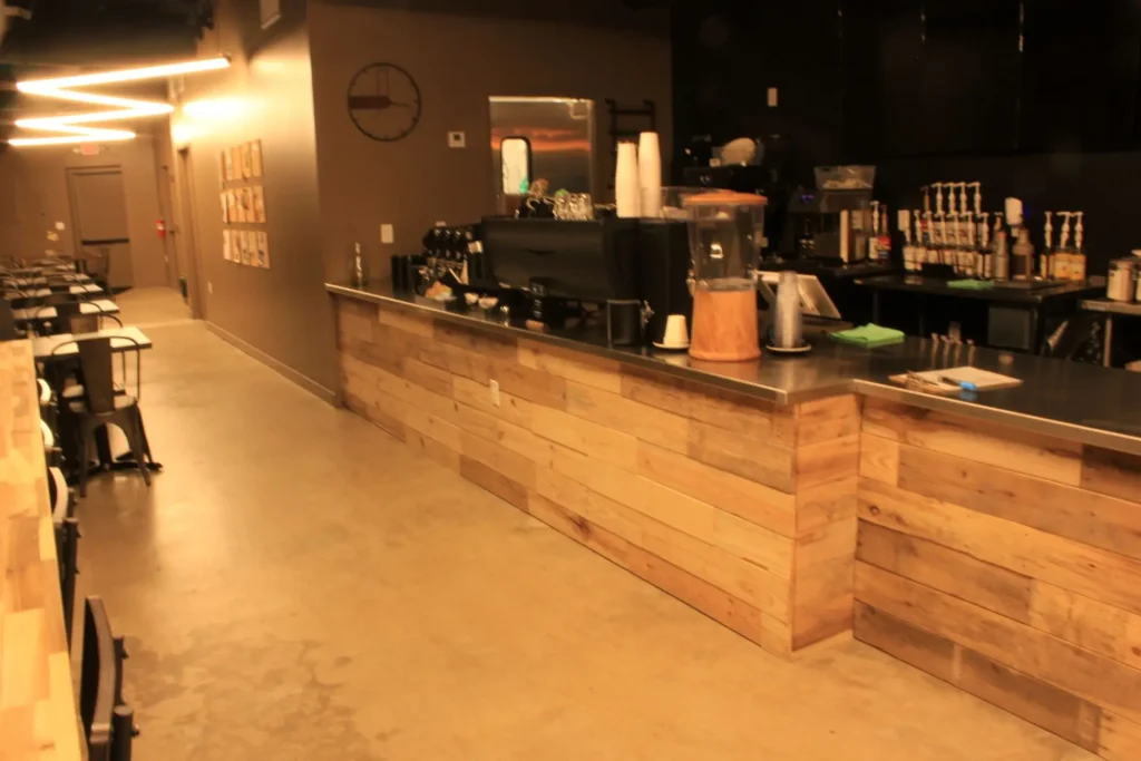 A long wooden bar with a polished counter