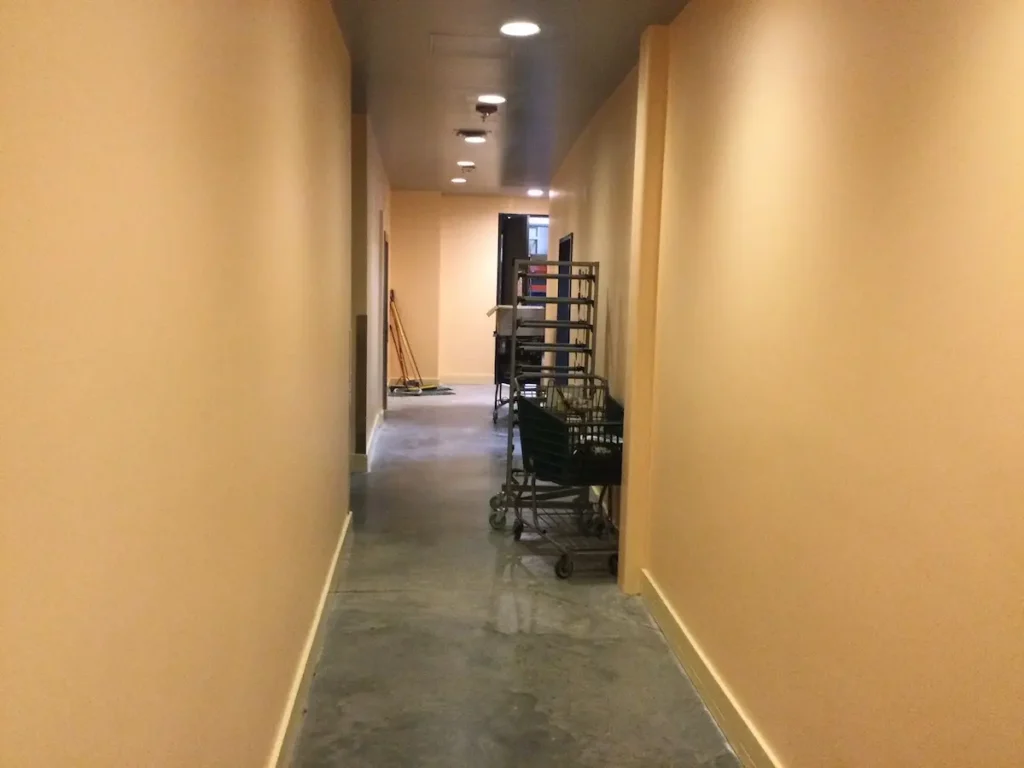 A long hallway featuring a cart positioned in the center