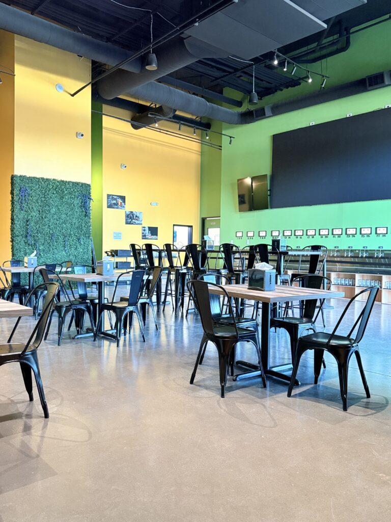 Finished dining area with custom seating, painted feature walls, and commercial interior finishes