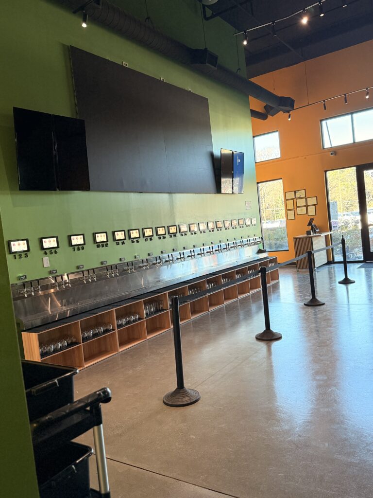 Self-pour beverage station with custom finishes in commercial taproom