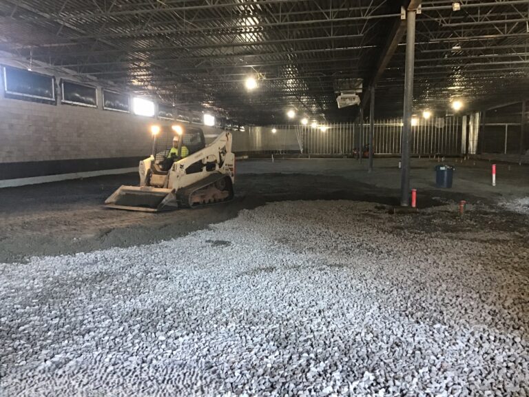 Lidl supermarket stone base installation building pad preparation during ground-up construction in Decatur GA