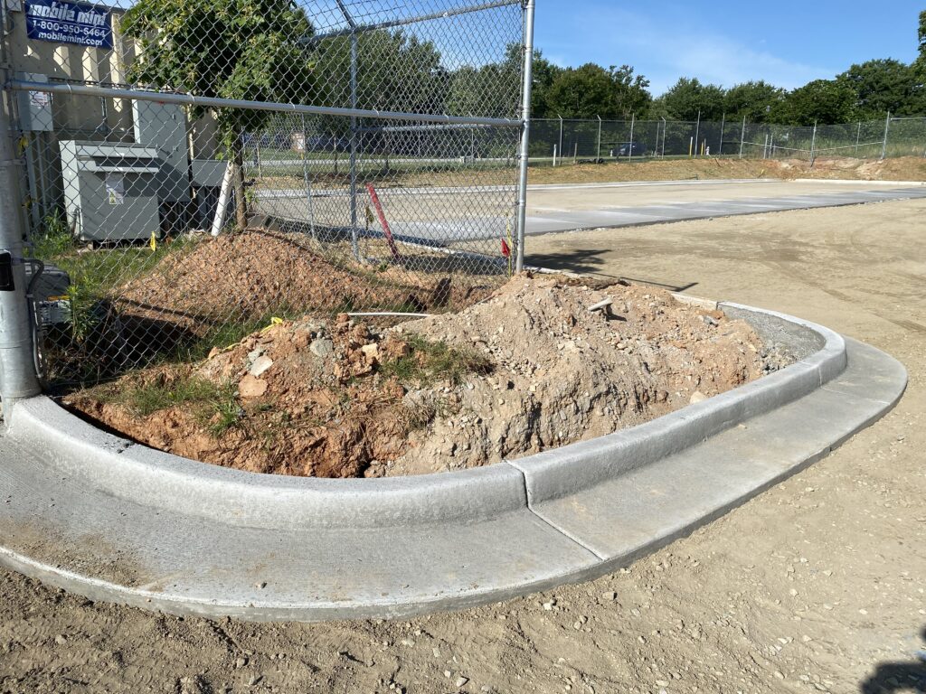 Landscape island construction with concrete curbing and site development improvements