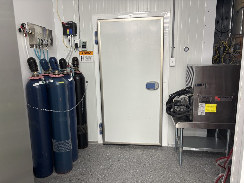 Walk-in cooler installation and beverage storage area in commercial taproom project
