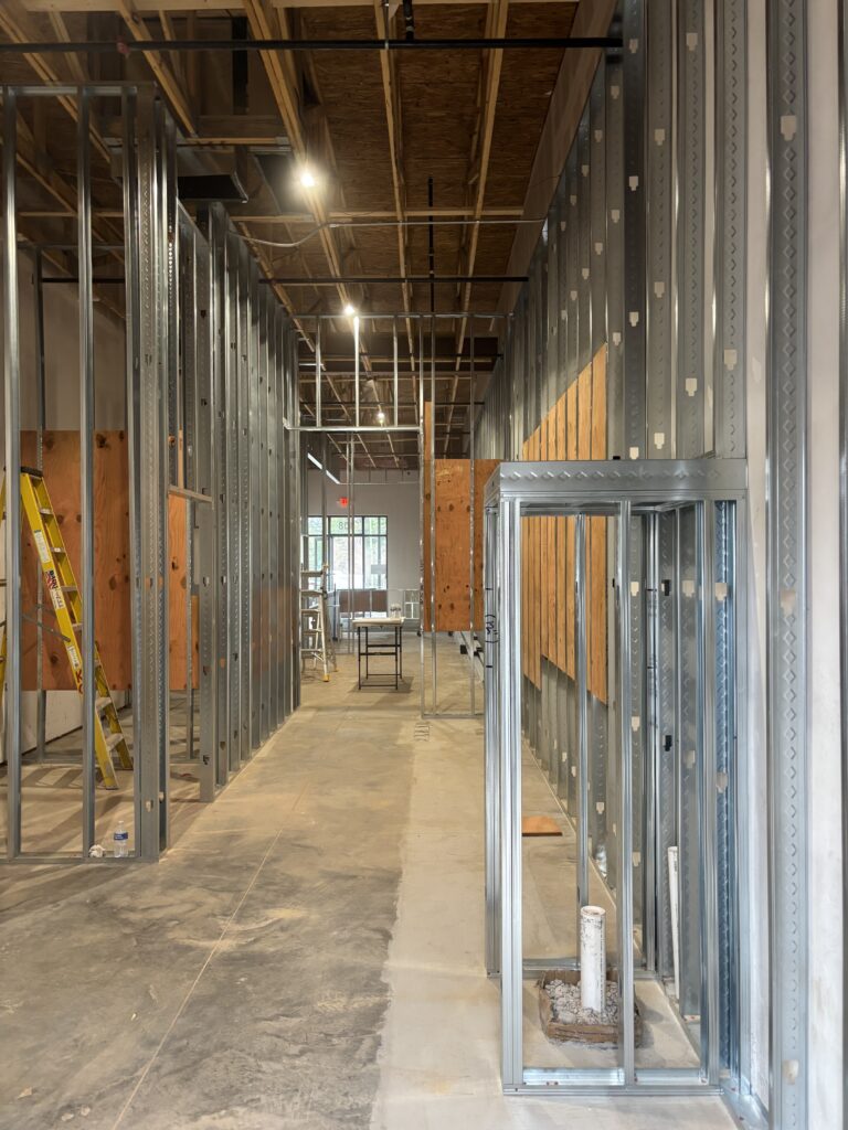 Completed interior wall framing and rough-in work for restaurant build-out construction