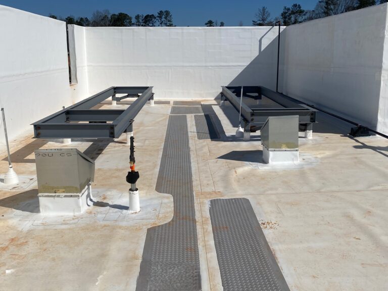 Lidl supermarket rooftop HVAC equipment supports and roof access walkway installation during final construction in Decatur GA