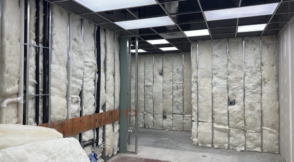 Taproom build out in Chamblee GA with insulated demising wall and framed opening for future cooler or storage room