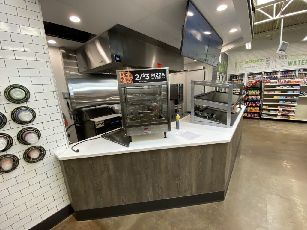 Convenience store remodel with updated grab and go food counter drink dispensers and tile backsplash