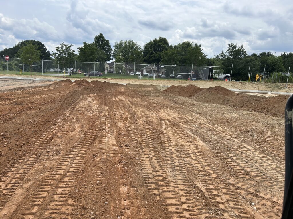 Rough grading operations for commercial parking lot construction and site development