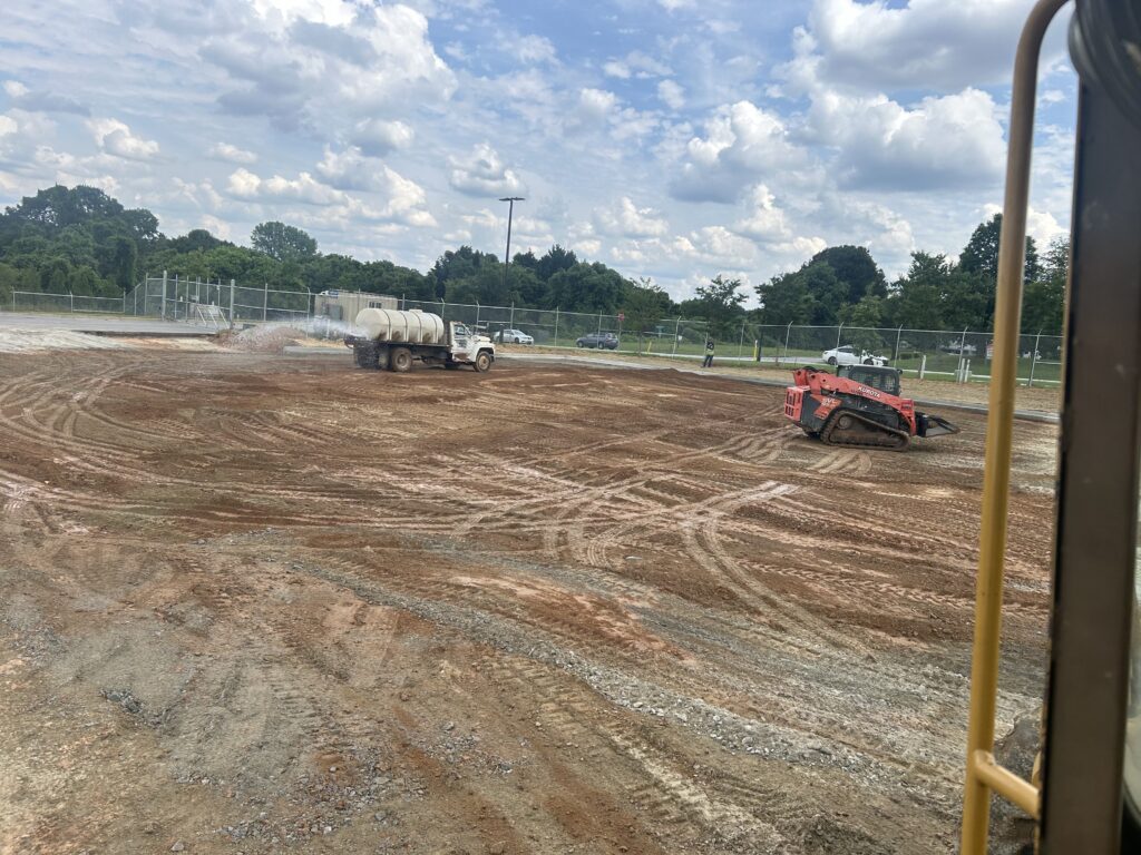 Earthwork and site preparation activities for commercial parking lot installation
