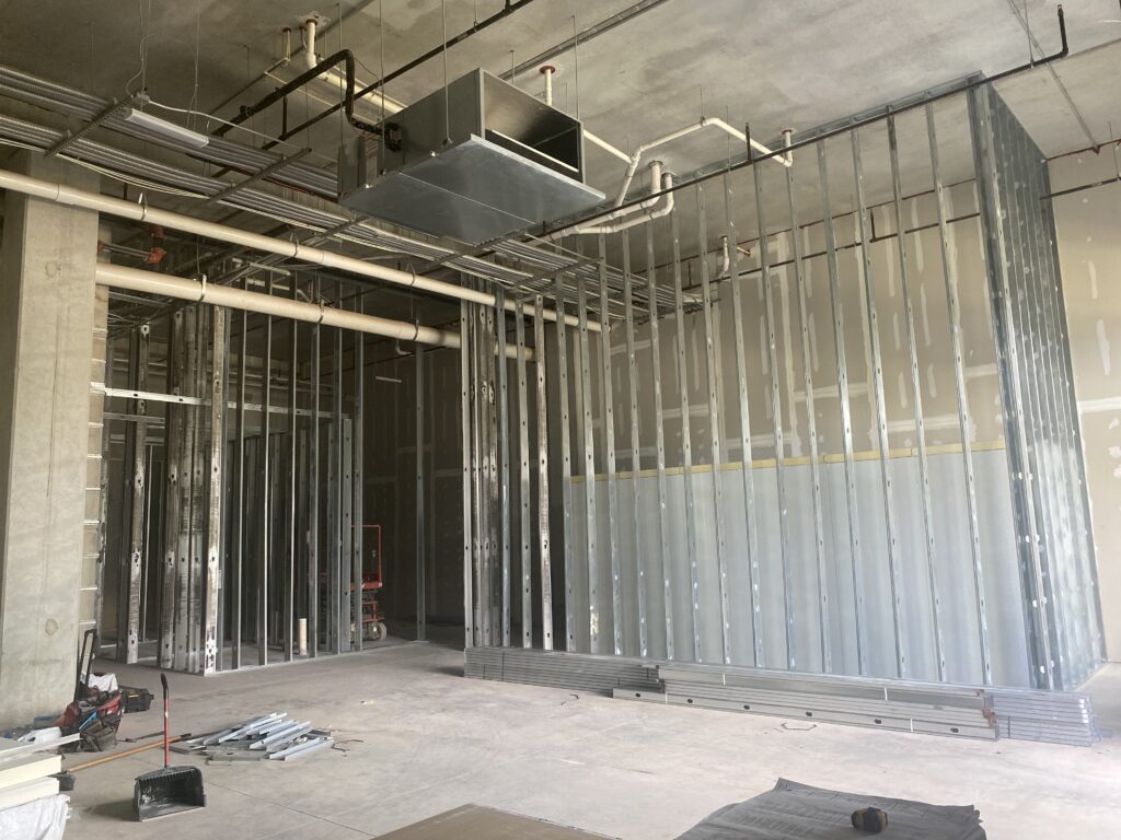 : Interior metal stud framing and wall layout for commercial taproom build-out