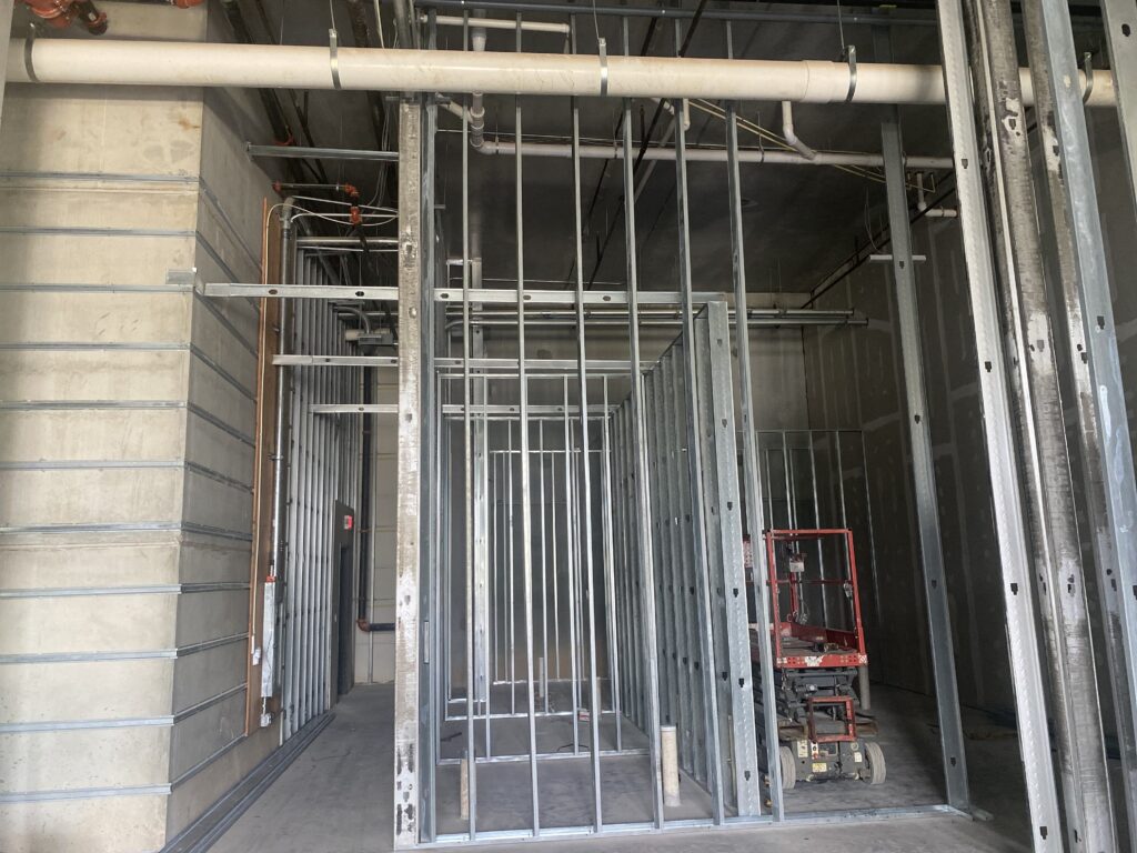 Metal stud wall framing installation for commercial taproom build-out project