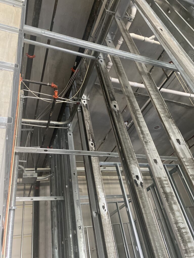 Metal stud wall framing installation for commercial taproom and restaurant construction