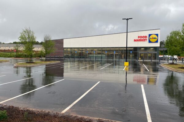 Completed Lidl grocery store storefront and parking lot in Decatur GA with finished exterior facade and sitework