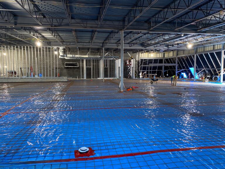 Lidl supermarket vapor barrier and slab reinforcement installation during ground-up construction in Decatur GA
