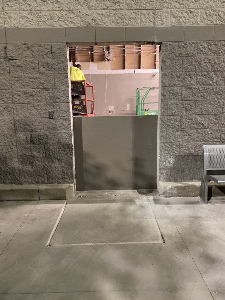 Commercial doorway cut-in and wall modification during Target retail remodel project