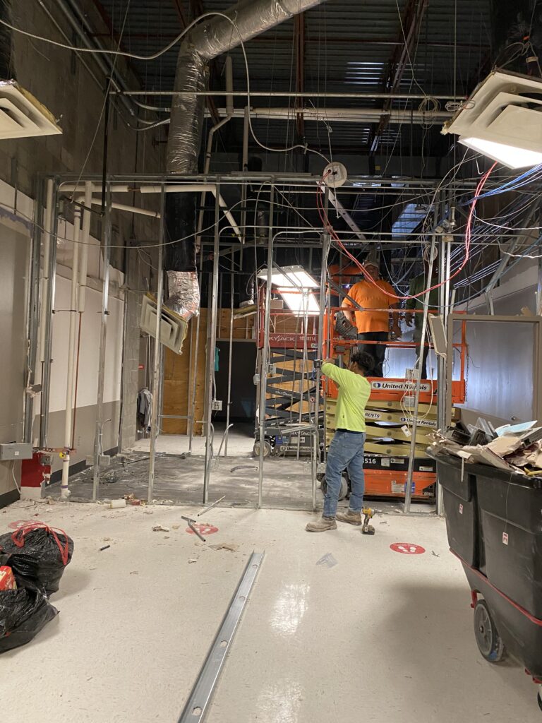 Target retail remodel framing and overhead MEP coordination during active commercial interior renovation