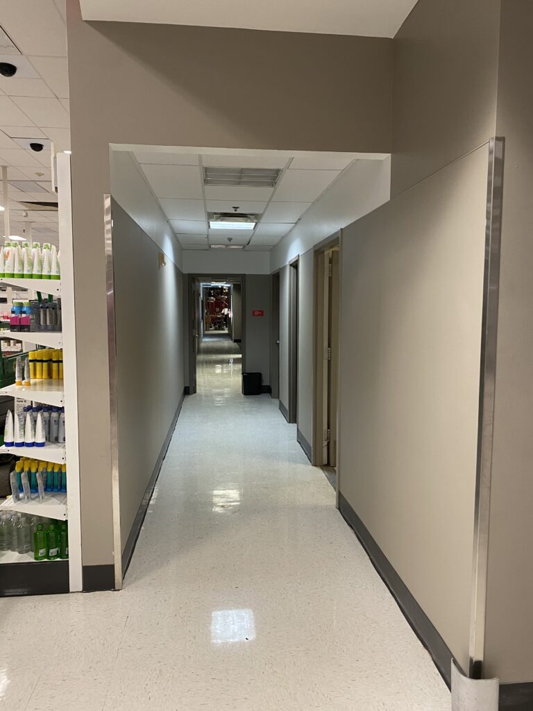 Target retail remodel corridor with finished walls, ceiling grid, and completed commercial interior hallway construction