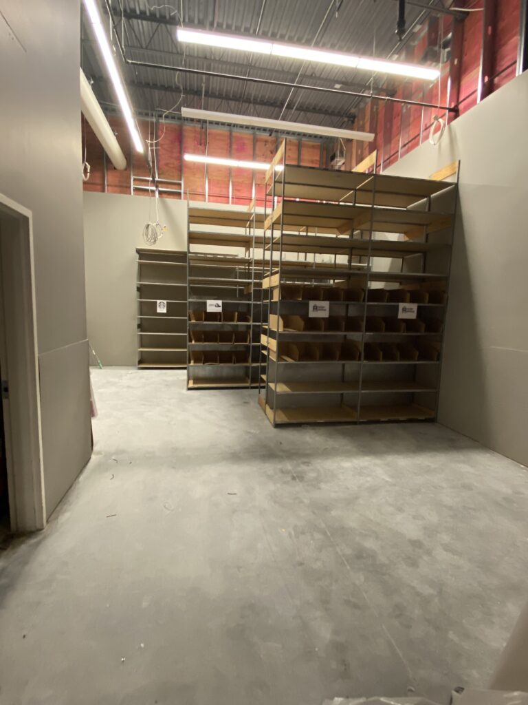 Target remodel back-of-house storage area with commercial shelving installation and completed interior finishes