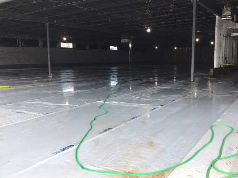 Lidl supermarket slab curing and moisture protection installation during ground-up construction in Decatur GA